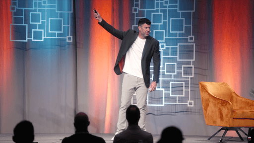 Ryan Zink on stage at a Franchise Sidekick event