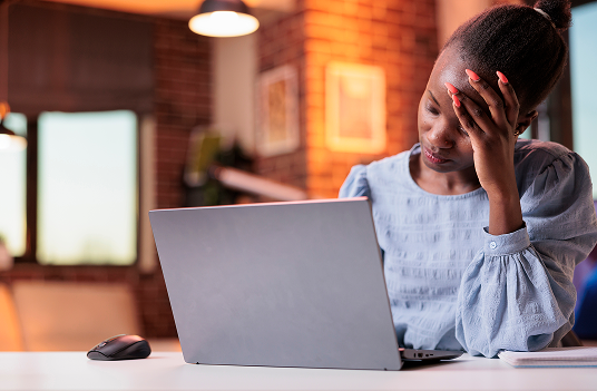 stressed-young-female-freelancer-having-headache-working-laptop-corporate-employee-burnout-concept-tired-busy-african-american-businesswoman-unhappy-employee-workplace 1