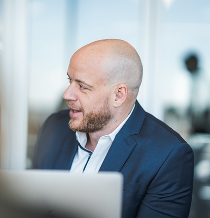 man looking over and speaking to someone