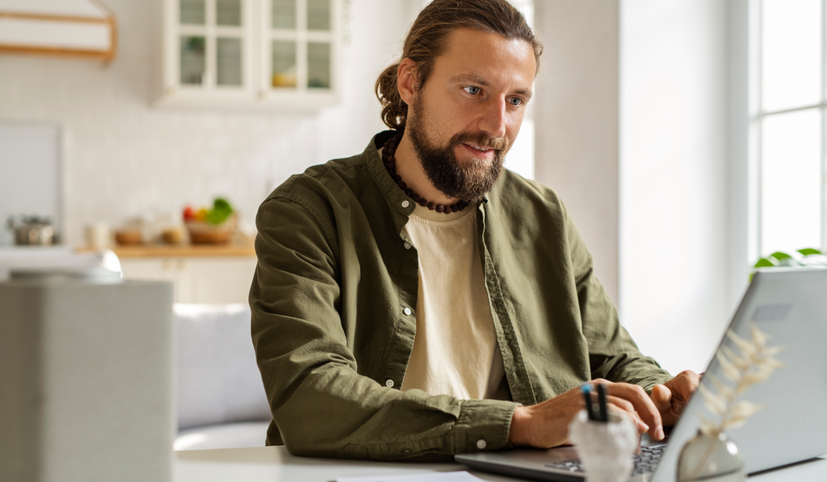 Middle aged man doing research on a computer