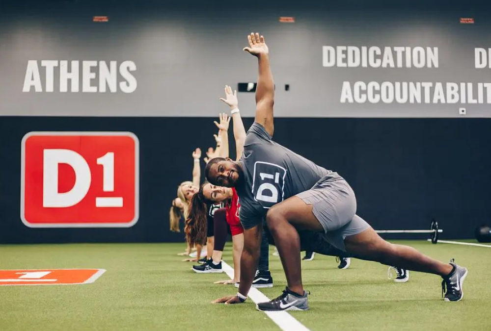 A group of men and women participating in a fitness class