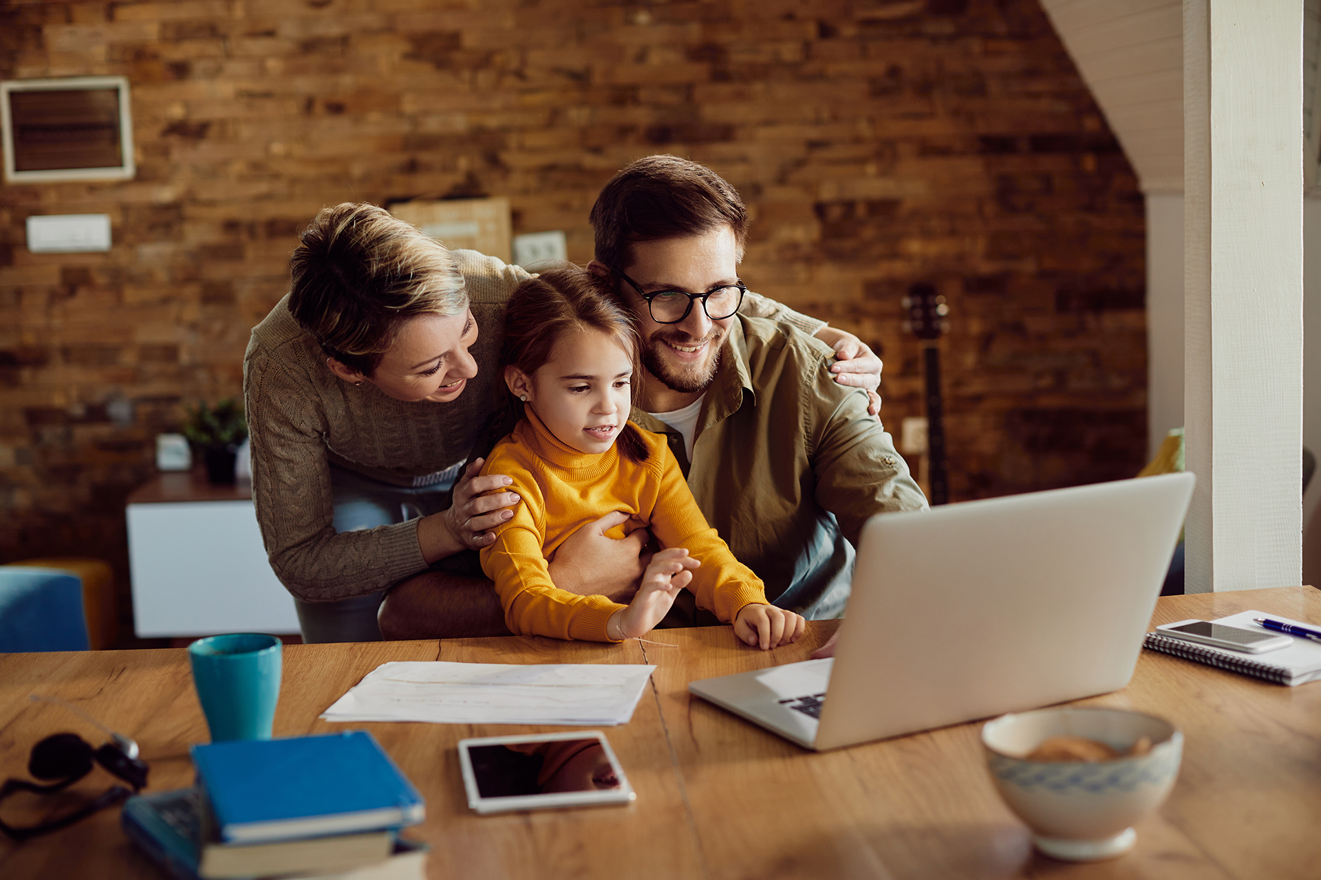 A family looking at a computer